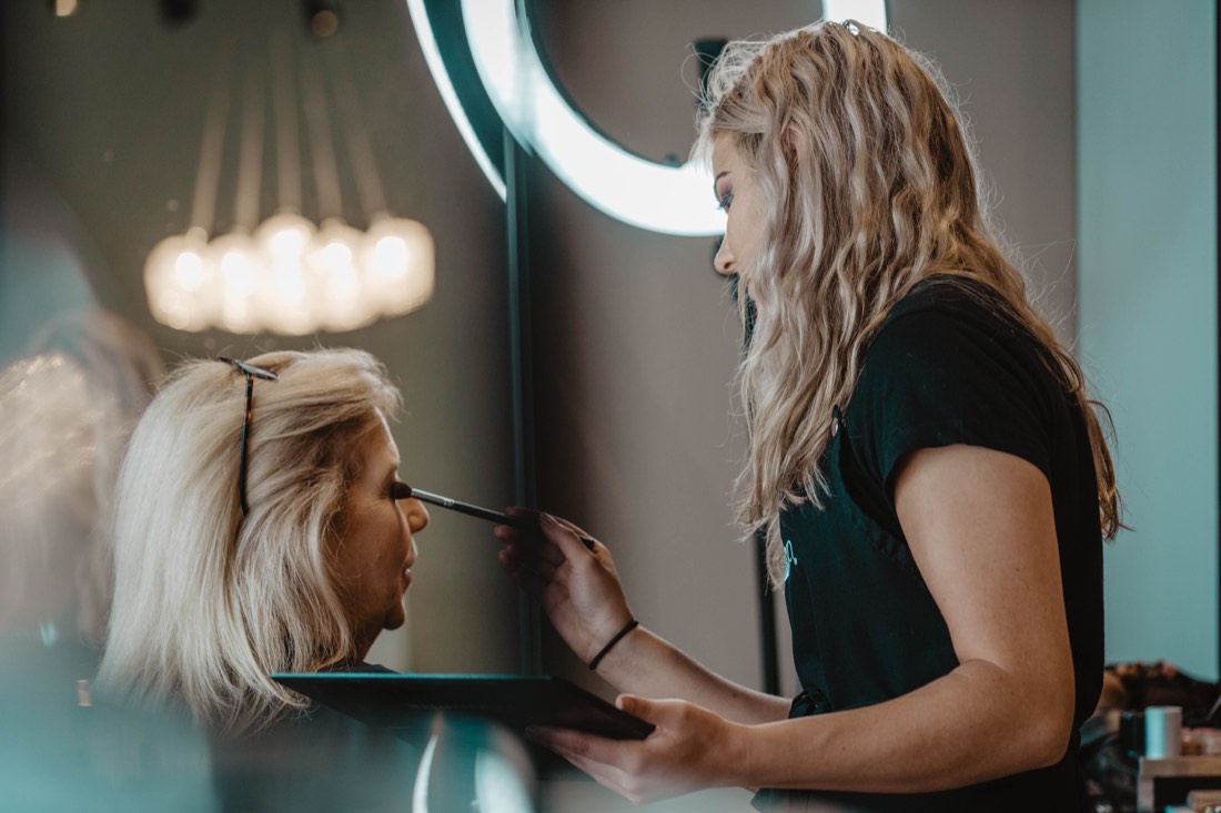 Stylist working on a client in a salon